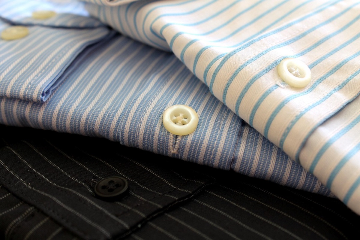 modern men's clothing rack with curated outfits