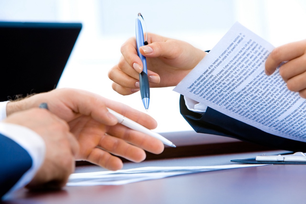 modern office desk with luxury notebook and silver pen