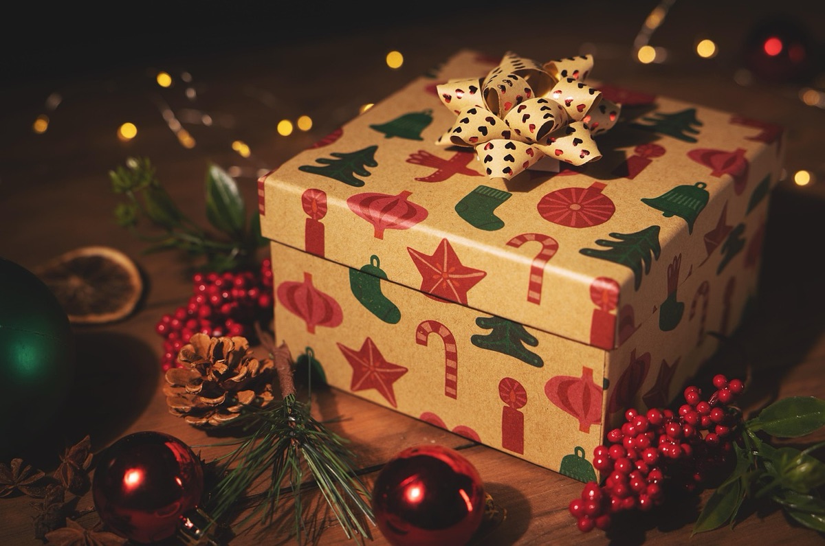 Wrapped gift box with red ribbon